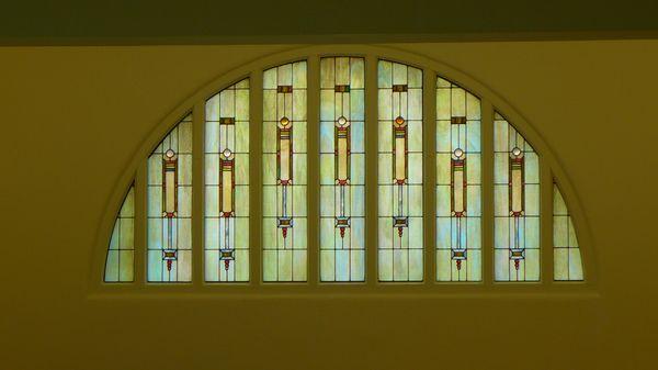 Stained glass window over entry.