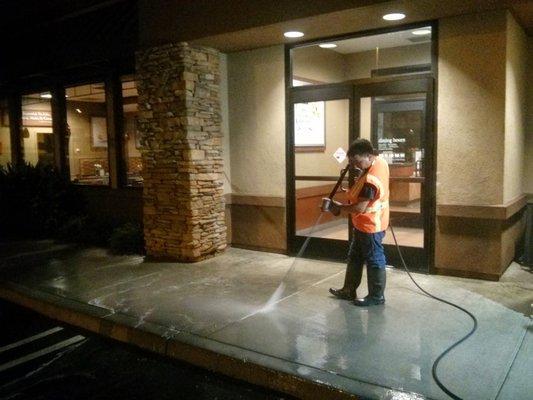 Pressure washing an entrance to a popular restaurant.