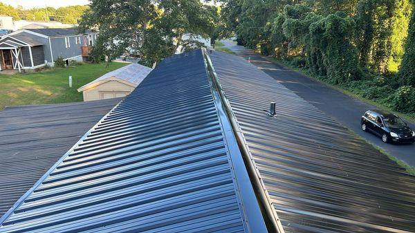 Mobile home black metal roofing.