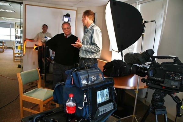 Producer Geoff Birmingham consulting with interviewee for MassBay marketing video