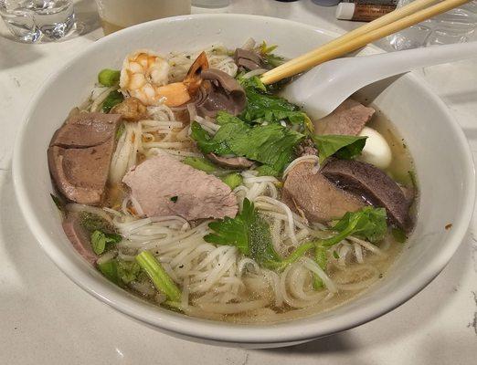 #5 White Noodle Hu Tieu Soup (with pork, shrimp, pork kidney, liver, quail egg, celery, cilantro, and fried shallots). -$12