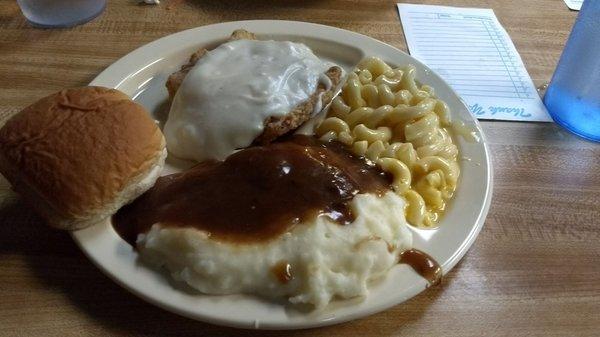 Country fried steak, mashed potatoes and Mac n cheese