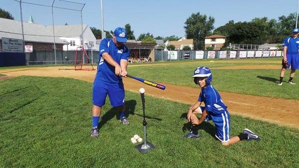 Coach gives a demo of hand placement.