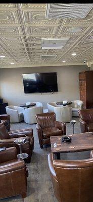 Indoor lounge with 2 82" TVs