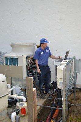 Nick Hopper, commissioning Mitsubishi condenser for multi zone split system. In Diablo, CA.