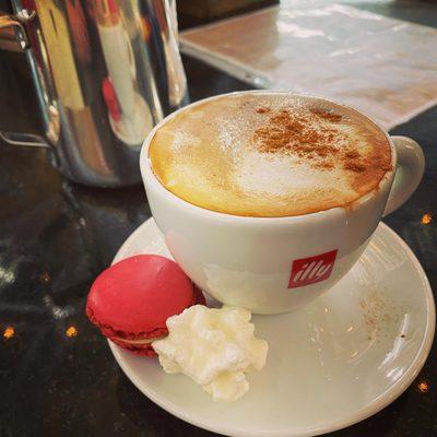 Perfect latte with a side of macaron