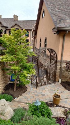 Custom made wrought iron arbor in Williamsport, PA  to match existing metal railings, trellises and Pergola.