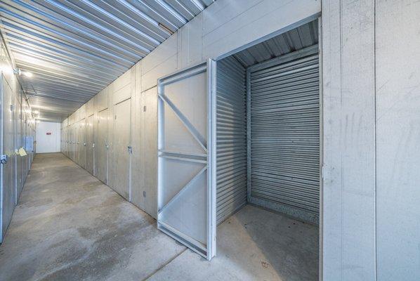 Clean small inside storage units and well lit hallway.