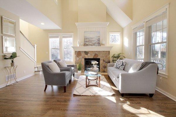 Thoughtful details in this staged living room showcases the gorgeous windows and open floor plan.