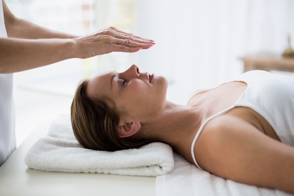 Reiki can be done while laying down while I place my hands slightly above your body's energy centers