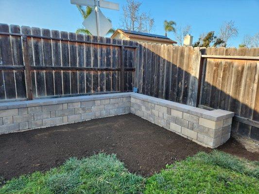 Beautiful retaining wall replaced a large raised planter bed in our back yard