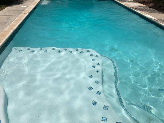 Yay! Our pool now !  Remodeled steps, new reef step, new tile, new plaster with quartz. Even added the Turtles and raised the deep end seat.