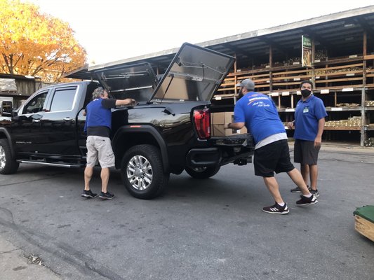 The guys loading the cupboards