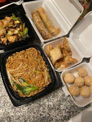 Vegetable lo mein, sesame balls, garlic chicken, pork egg rolls, and Crab cheese wonton l