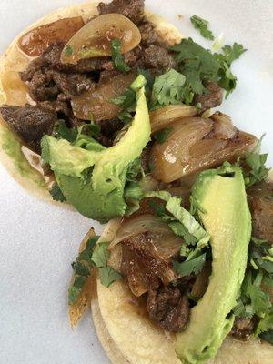 Walla walla tacos with fresh sautéed onions, spices and avocado!