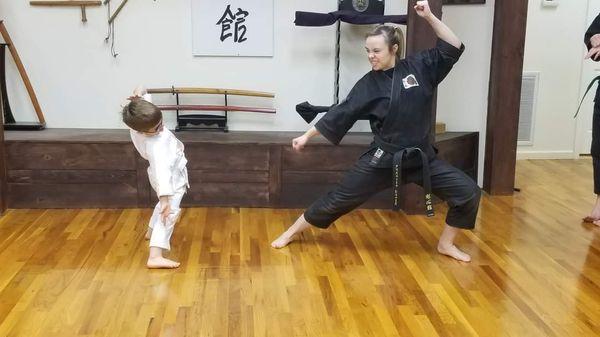 Dojo Sensei Lehmuth with student at Pizza party event