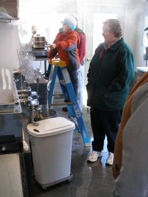 Visitors enjoy learning about how maple sap is boiled down.