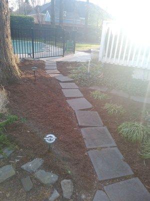 Replacing mulch front and back yard