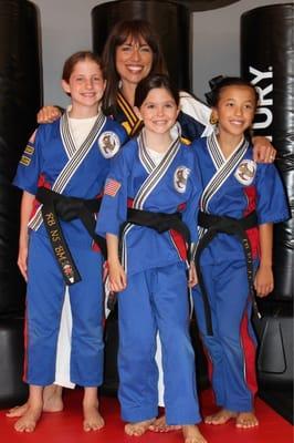 Triple threat! Black belts in martial arts and in life.