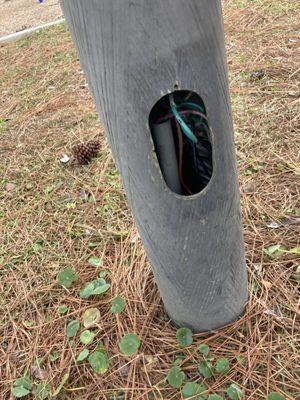 Dangerous light pole by the playground