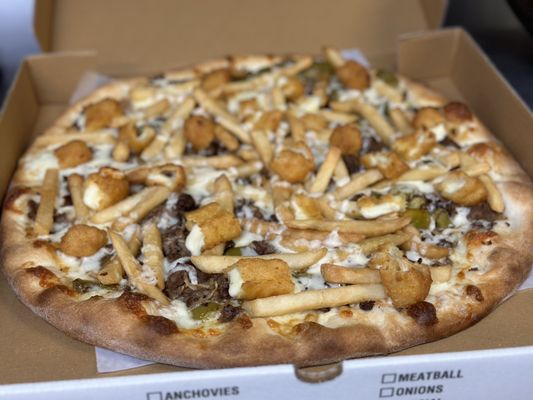 Our cheesesteak pizzarama pizza , ( philly cheesesteak pizza topped with FF & Mozz stix