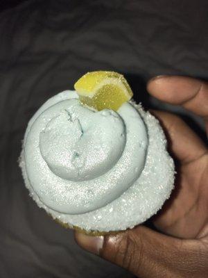 Blue raspberry cupcake with gummy lemon wedge