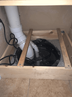 Radon Mitigation system being installed in the basement of el paso county home