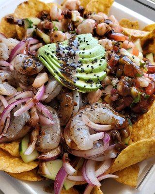 Tosti botana mixta
( aguachile negro y ceviche de camarón)