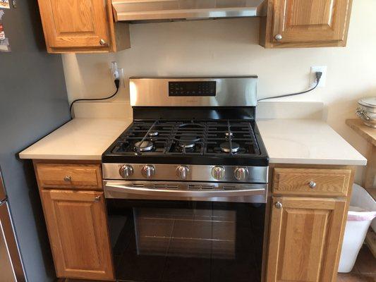 Countertop flanking the range.