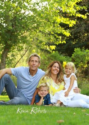 Family frolicing in the leaves Boise