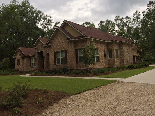 Lawn maintenance and pine straw job at a home in Crawfordville.