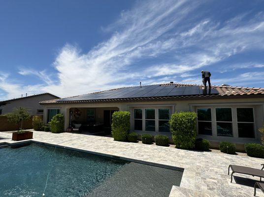 Installers finishing a solar installation