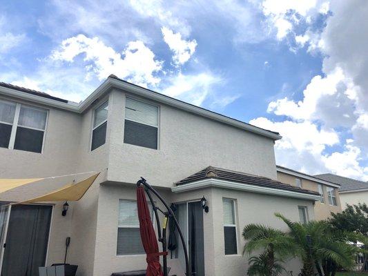 Backyard showing gutters on both levels.