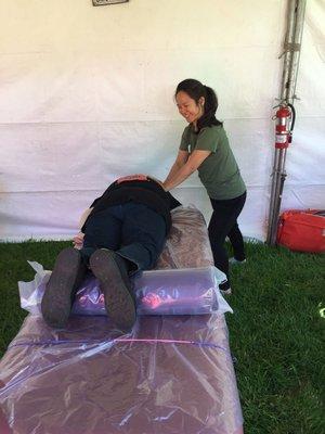 Junia helping Tour de Cure cyclists with sports massage for American Diabetes Association Palo Alto fundraiser