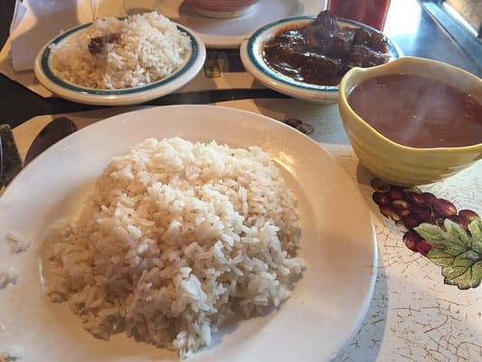 Dominican-style rice, pinto beans and beef.