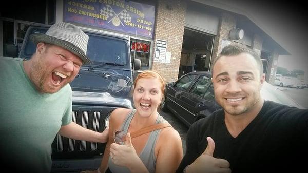 Our Sales Manager Mike James with Eric and Emily, the new owners of a Jeep Wrangler.