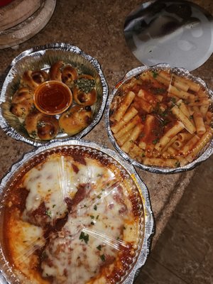 Chicken Parmigiana, ziti, and garlic knots.