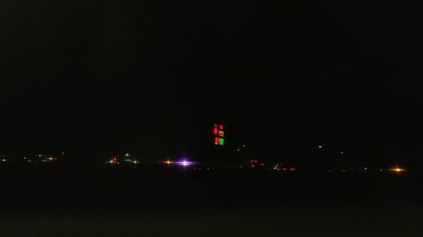 the sign way in The distance by the interstate ambulance coming over the hill.