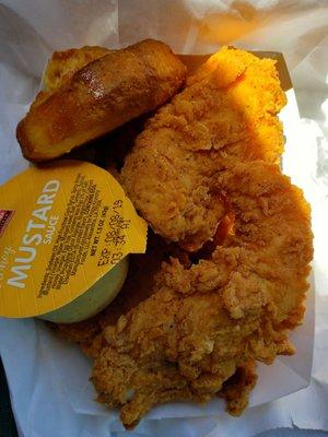 Tenders and a biscuit  with honey mustard on the side