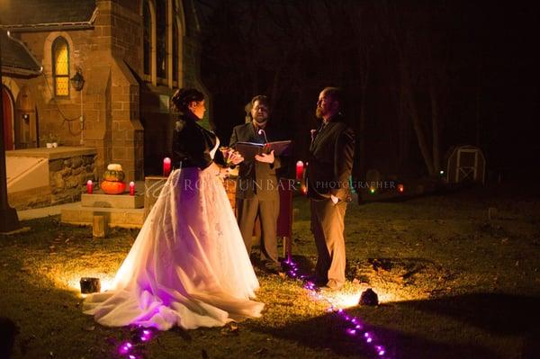 Halloween night wedding in an old graveyard.