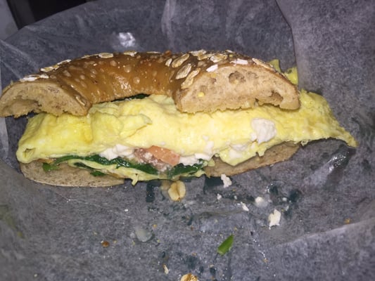 Spinach tomato that a breakfast sandwich on an Indian harvest bagel.