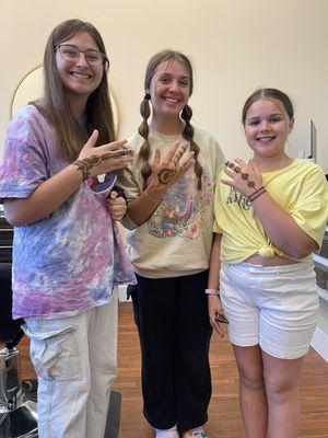 Clients showing their henna tattoos