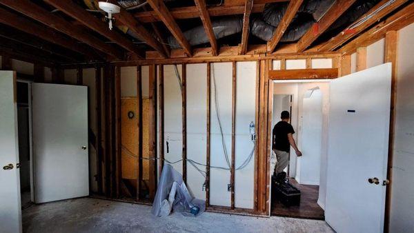 After severe water damage, drywall and floor had to be removed.