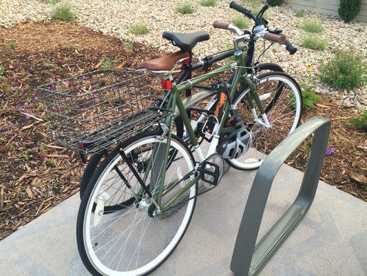 My Critical single-speed in front (green) and my husband's in back(black). (I added the basket separately).