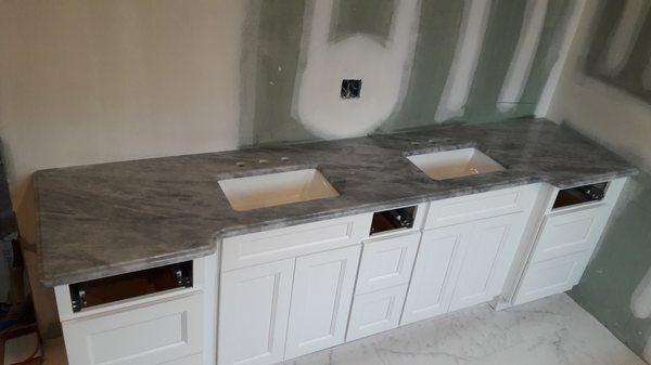 Beautiful double sink vanity with marble countertop.