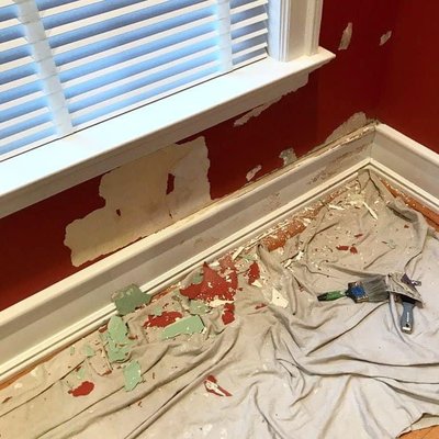 Chipped paint and baseboard damage