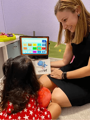 Therapist reading to a child.