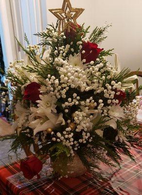 Roses, babys breath, cedar, white lily ornamentmental decoration