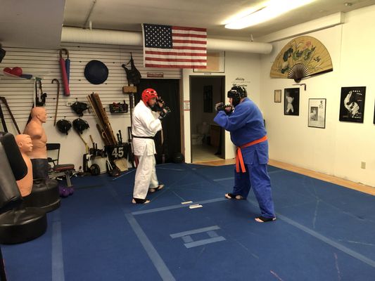 Our adults enjoying some light sparring to relieve some of the stress of the week.