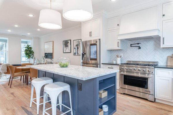 Inset Custom Cabinets
 Island Blue Shaker Inset Cabinet
 MSI Quartz Countertop
 Subway Tile
 Hardwood Floor